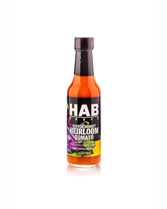 A bottle of HAB Family Scotch Baked Heirloom Tomato hot sauce on a clean white background.